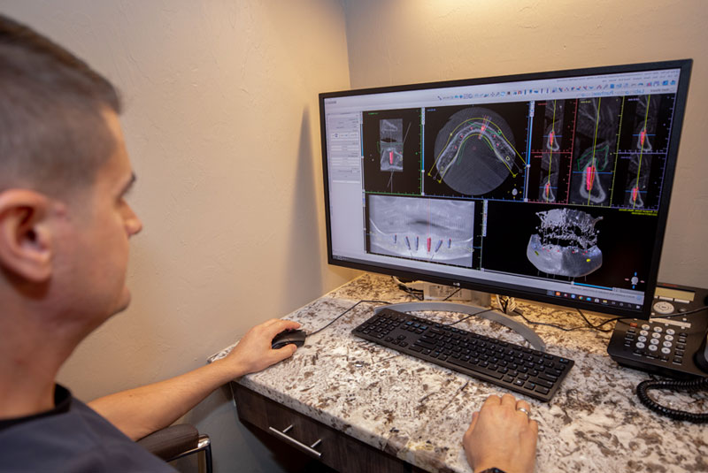 dr titov with computer looking at guided surgical plans