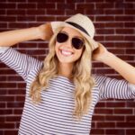 Smiling blond woman wearing a striped shirt