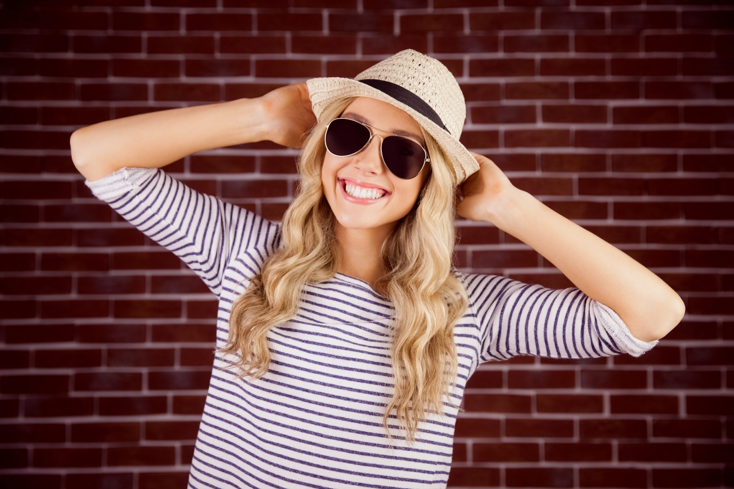 Smiling blond woman wearing a striped shirt