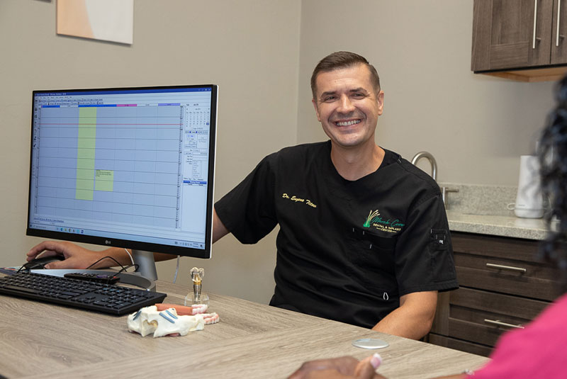 doctor going over dental procedure information with patient